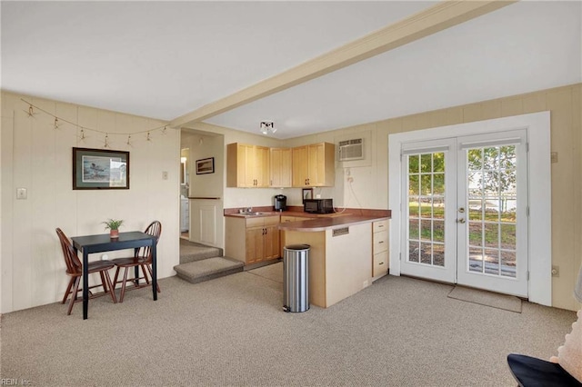 kitchen featuring light colored carpet, french doors, black microwave, and a sink