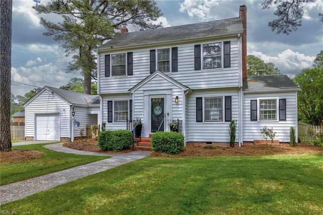 colonial home with a chimney, an attached garage, and a front lawn