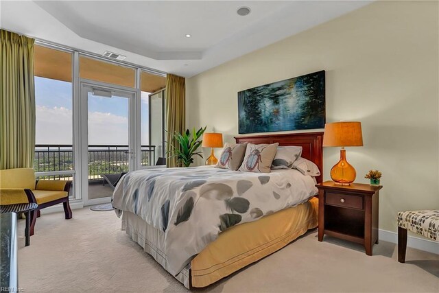 bedroom with baseboards, visible vents, light colored carpet, and access to exterior