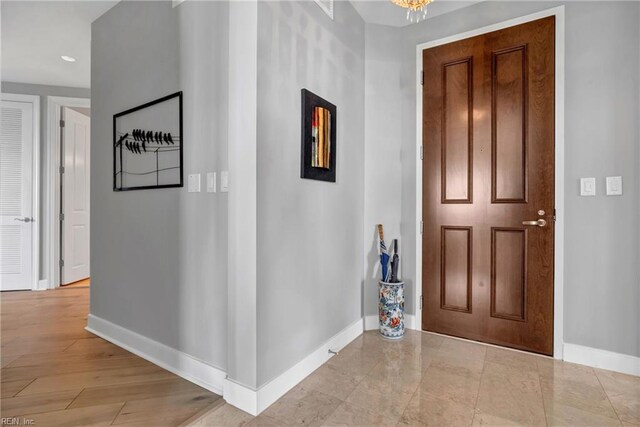entrance foyer featuring baseboards and recessed lighting