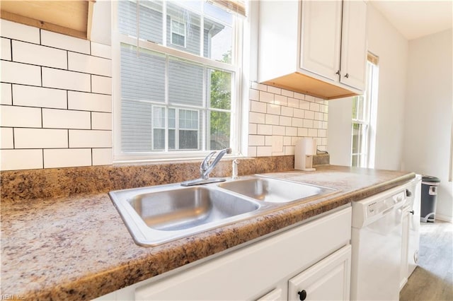 313 N Lloyd St, Suffolk, VA 23434 - kitchen featuring dishwasher, a sink, white cabinets, and tasteful backsplash