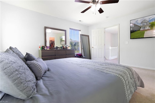 bedroom featuring carpet floors, baseboards, ceiling fan, and visible vents