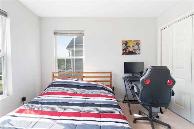 carpeted bedroom featuring a closet