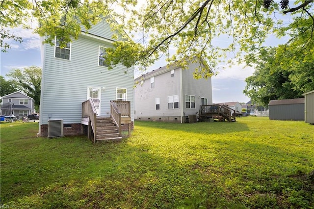 back of house with a lawn, crawl space, and cooling unit