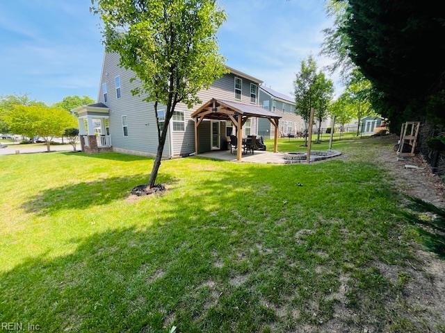 back of house with a patio, a yard, and a gazebo