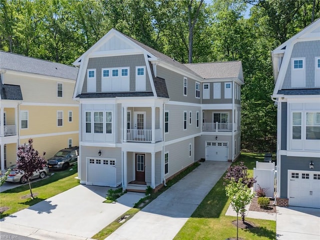 view of front of property featuring a garage, board and batten siding, a balcony, and driveway