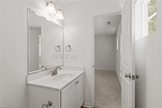 bathroom with visible vents and vanity