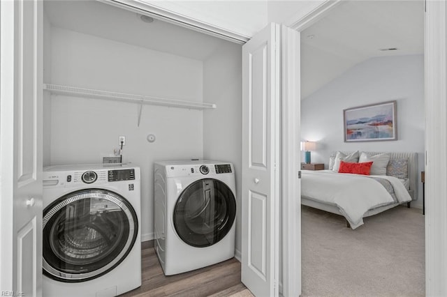 laundry area featuring laundry area and washing machine and clothes dryer