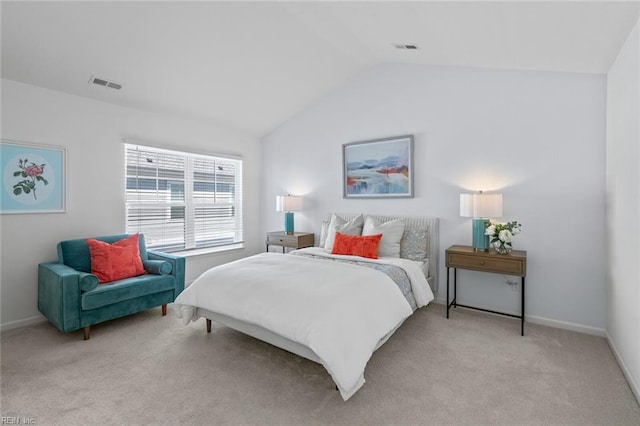 bedroom featuring baseboards, lofted ceiling, light colored carpet, and visible vents