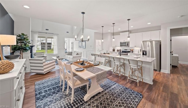 dining space featuring recessed lighting, visible vents, a chandelier, and dark wood-type flooring