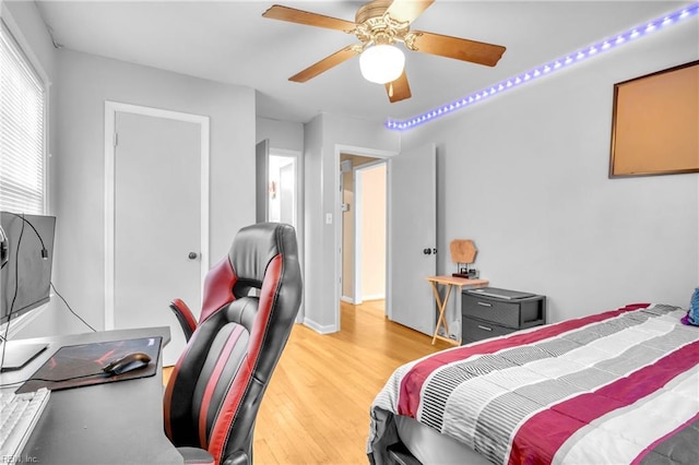bedroom featuring a ceiling fan and light wood-style flooring