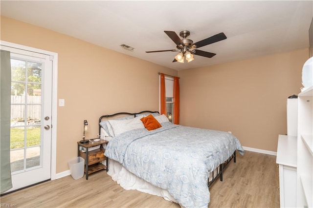 bedroom featuring baseboards, access to exterior, light wood-type flooring, and visible vents