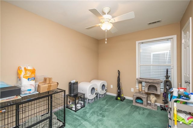 misc room featuring visible vents, carpet flooring, baseboards, and a ceiling fan