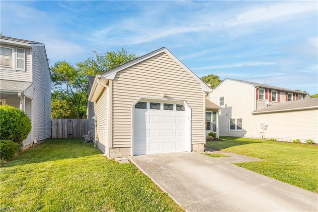 garage with fence and concrete driveway