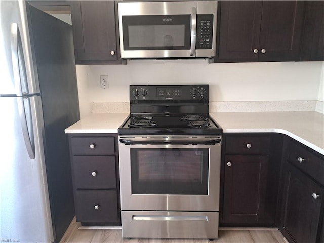 5541 Old Guard Cres, Virginia Beach, VA 23462 - kitchen with light countertops, appliances with stainless steel finishes, and dark brown cabinets