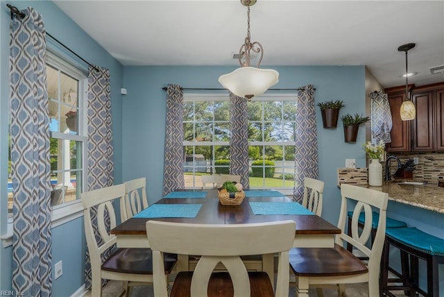 dining room featuring visible vents