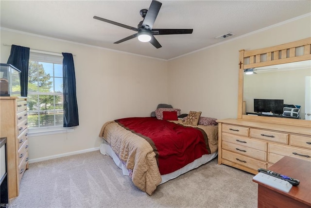 bedroom featuring visible vents, crown molding, and light carpet