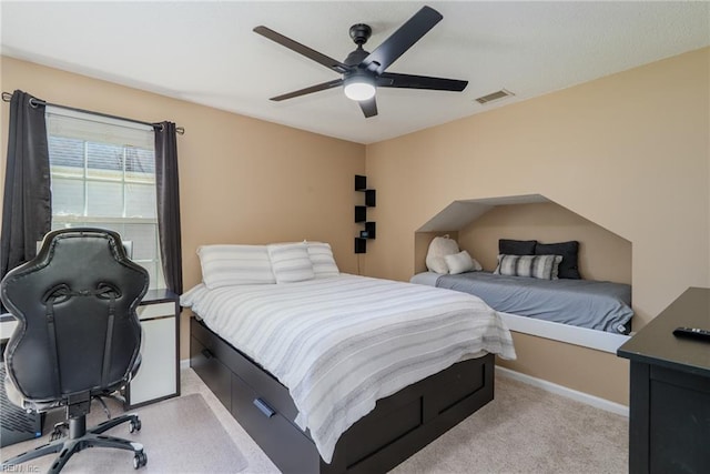 bedroom with visible vents, baseboards, ceiling fan, and light carpet