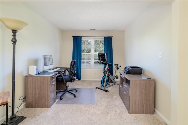 carpeted home office featuring baseboards and visible vents