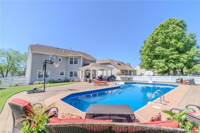 view of pool with a gazebo, a fenced in pool, a fenced backyard, and a patio area