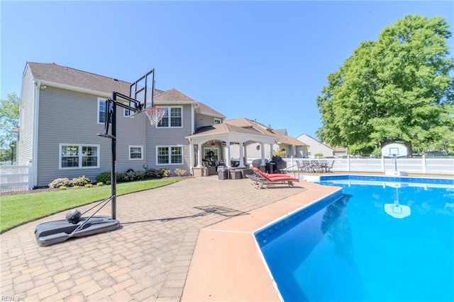 view of pool featuring fence, a gazebo, a fenced in pool, a patio, and a yard