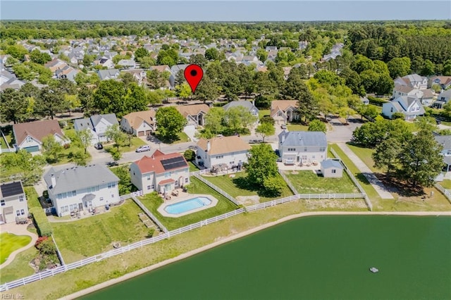 birds eye view of property with a water view and a residential view