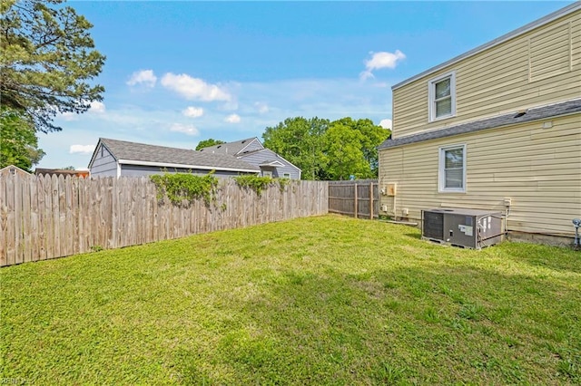 view of yard featuring a fenced backyard and cooling unit