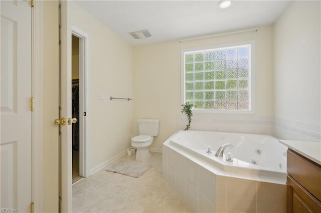 408 Leffler Ln, Virginia Beach, VA 23452 - bathroom with vanity, a whirlpool tub, toilet, visible vents, and a spacious closet