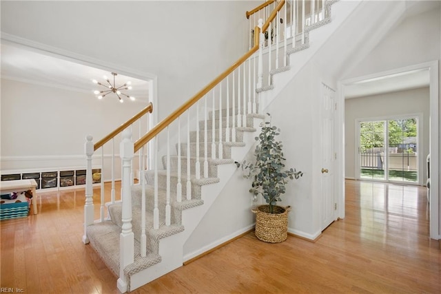 408 Leffler Ln, Virginia Beach, VA 23452 - staircase featuring a notable chandelier, wood finished floors, and baseboards