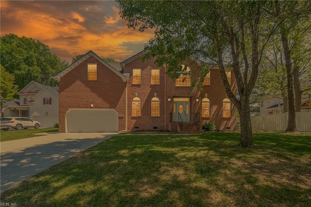408 Leffler Ln, Virginia Beach, VA 23452 - colonial inspired home featuring driveway, crawl space, fence, a front lawn, and brick siding