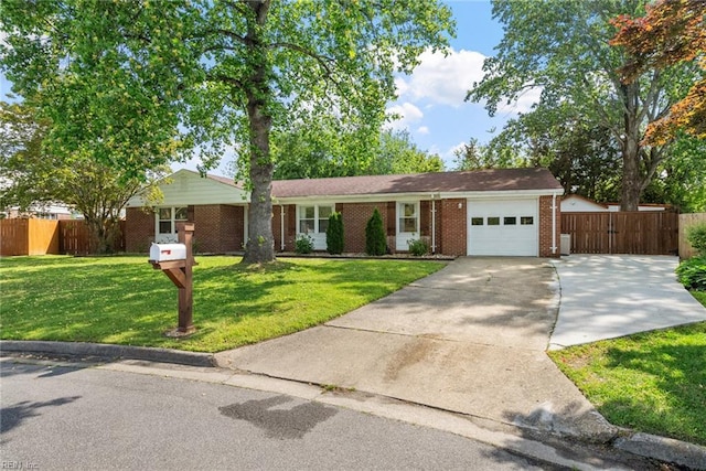 ranch-style house featuring a garage, fence, driveway, and brick siding