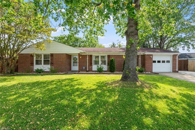 ranch-style house featuring a front yard, a garage, brick siding, fence, and concrete driveway
