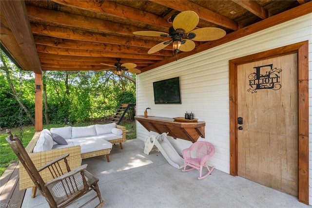 view of patio with a ceiling fan and outdoor lounge area