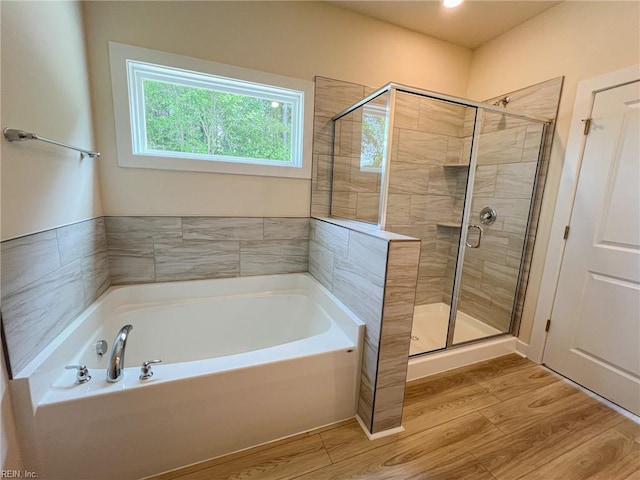 152 Mcpherson Rd, South Mills, NC 27976 - full bathroom featuring a bath, wood finished floors, and a stall shower