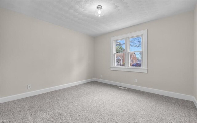 9254 Marlow Ave, Norfolk, VA 23503 - carpeted spare room with baseboards and visible vents