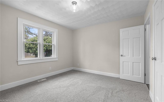 9254 Marlow Ave, Norfolk, VA 23503 - carpeted spare room with baseboards and visible vents