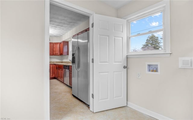 9254 Marlow Ave, Norfolk, VA 23503 - washroom featuring light tile patterned floors, baseboards, and hookup for a washing machine