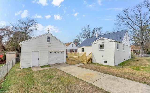 9254 Marlow Ave, Norfolk, VA 23503 - rear view of house with an outdoor structure, a garage, fence, driveway, and a yard