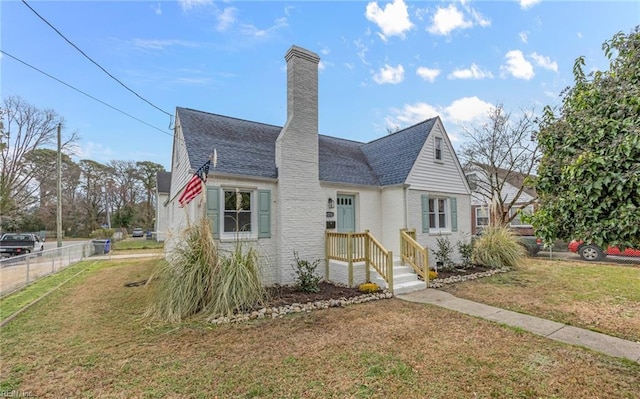 9254 Marlow Ave, Norfolk, VA 23503 - view of front of home with a chimney, a front yard, brick siding, fence, and a shingled roof