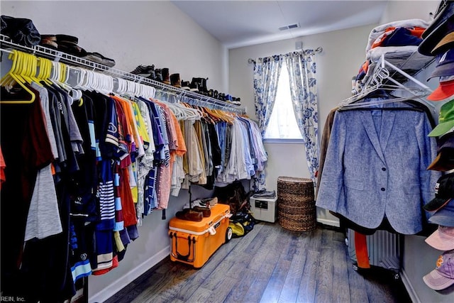 spacious closet featuring hardwood / wood-style floors and visible vents