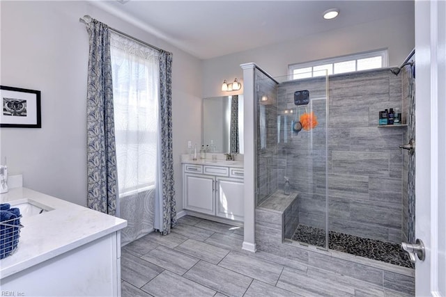 bathroom featuring vanity and a stall shower