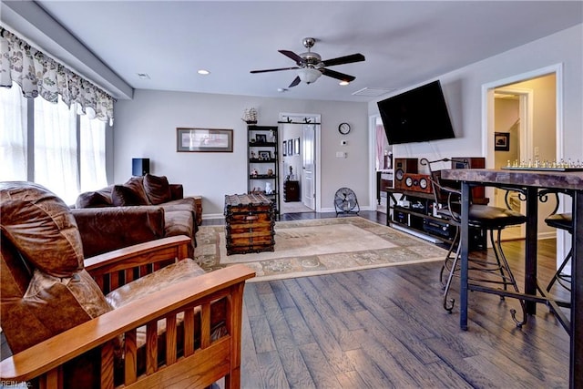 living room featuring baseboards, ceiling fan, recessed lighting, and wood finished floors