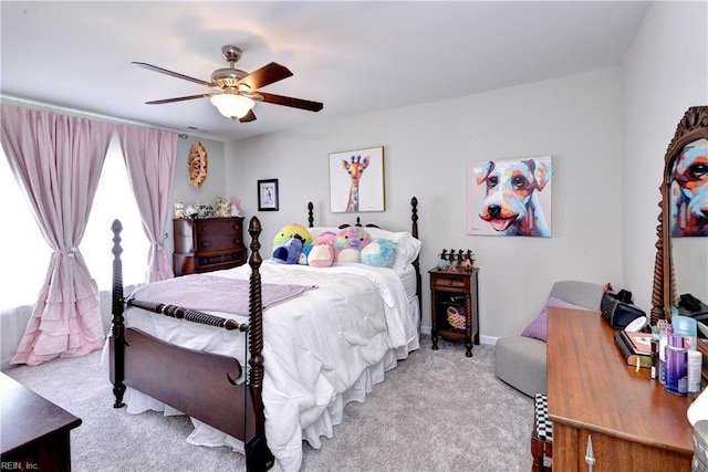 bedroom featuring ceiling fan and light carpet