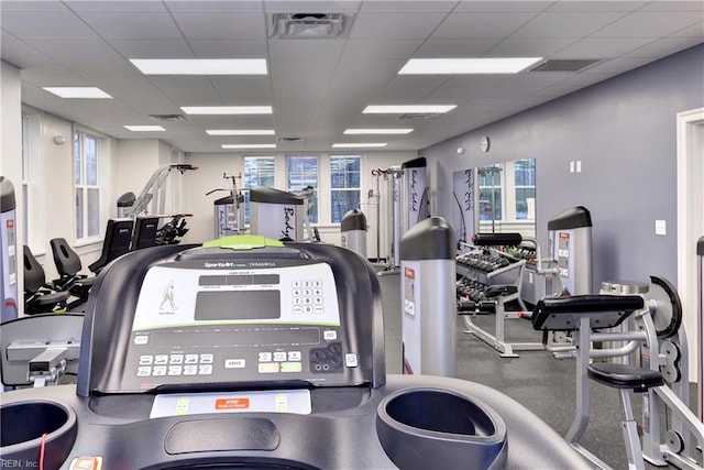 gym featuring visible vents and a drop ceiling