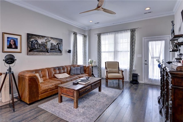 living area with a healthy amount of sunlight, ceiling fan, and dark wood-style flooring