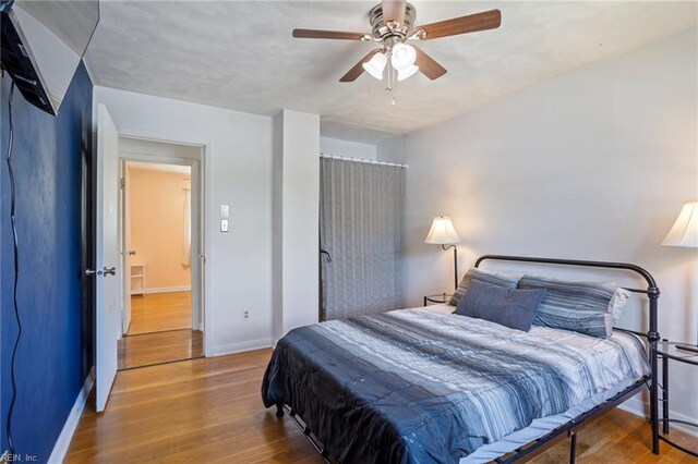 110 Greenwell Dr, Hampton, VA 23666 - bedroom featuring baseboards, a ceiling fan, and wood finished floors