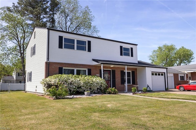 110 Greenwell Dr, Hampton, VA 23666 - traditional home featuring fence, an attached garage, a front lawn, and brick siding