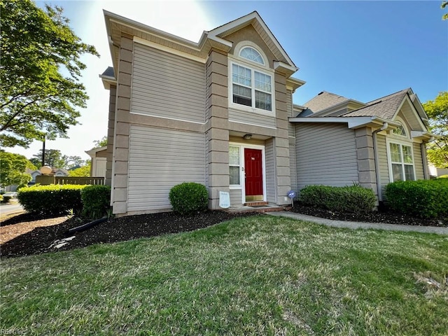 traditional-style home with a front lawn