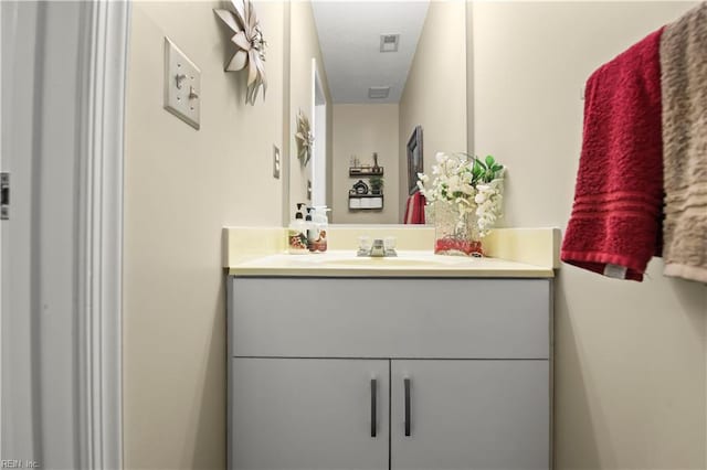 bathroom featuring visible vents and vanity