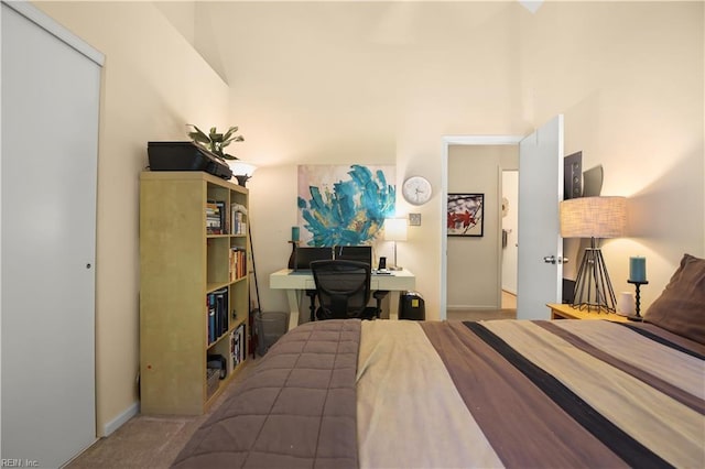 carpeted bedroom featuring baseboards